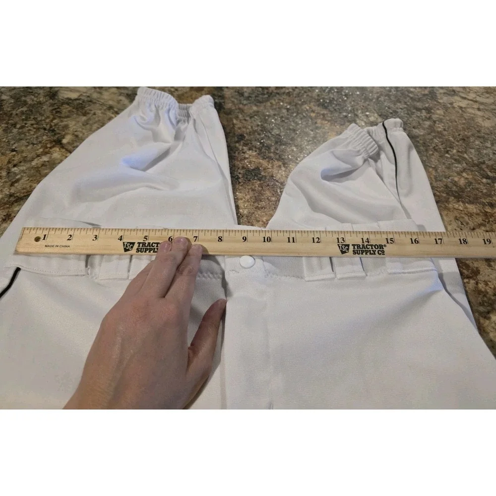 Under Armour branded inner waistband, tunnel belt loops, double snap closure. LG